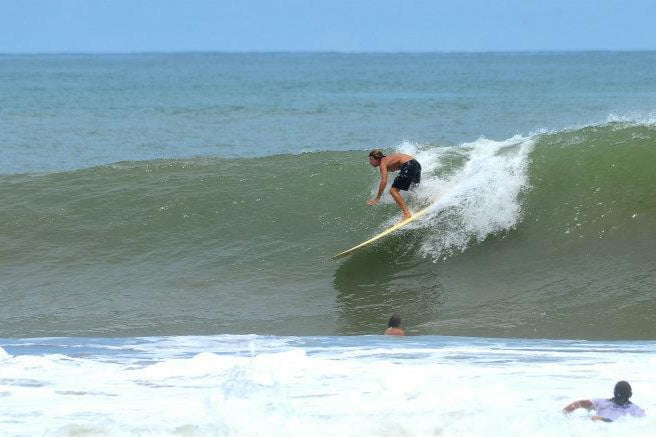 Kuana co-founder surfing in Costa Rica
